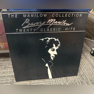 Barry Manilow vinyl record in paper sleeve and in the album cover